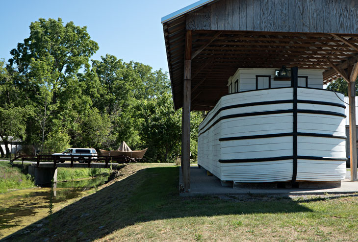 Boat with Erie Canal boat replica in New York